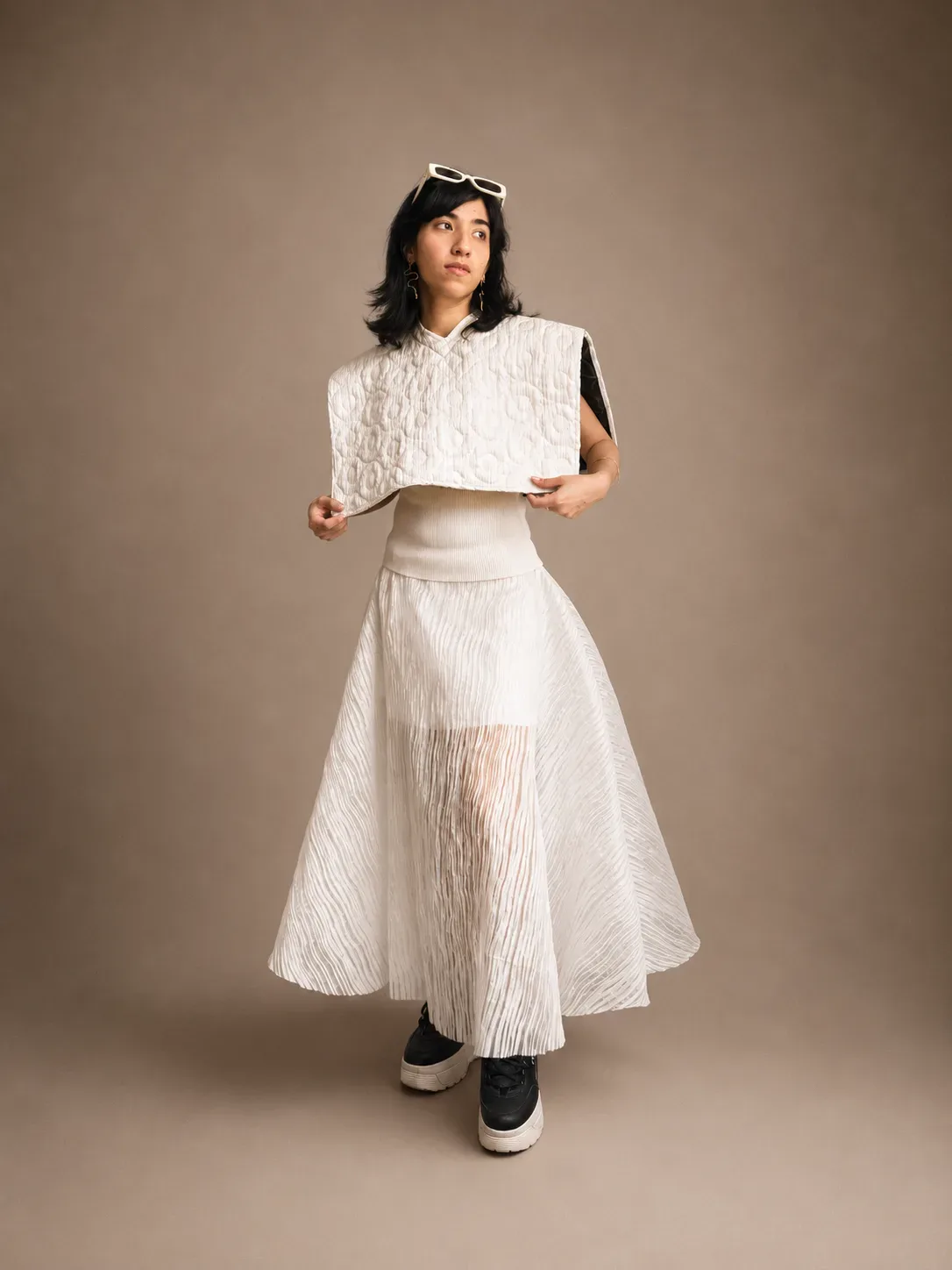 Full-length pleated skirt with a quilted cape